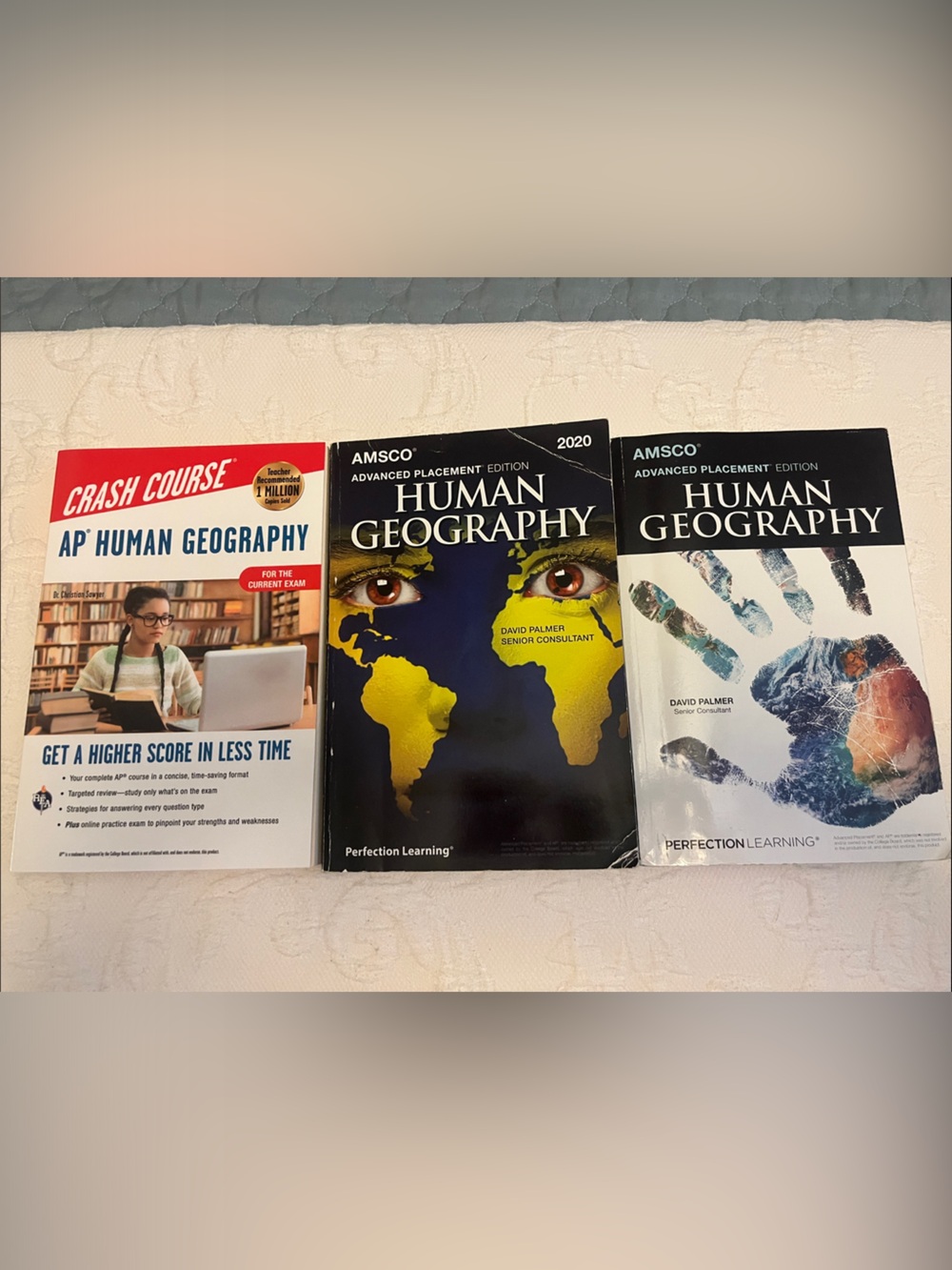 Three AP Human Geography books